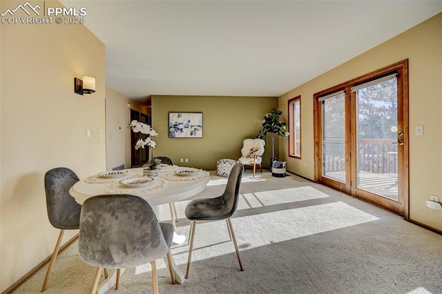 view of carpeted dining space