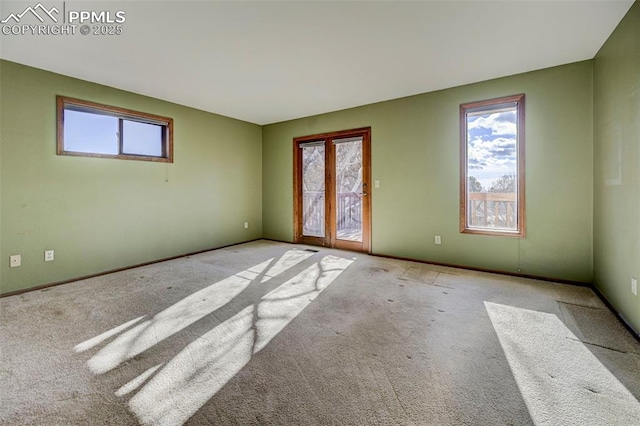 unfurnished room with light colored carpet