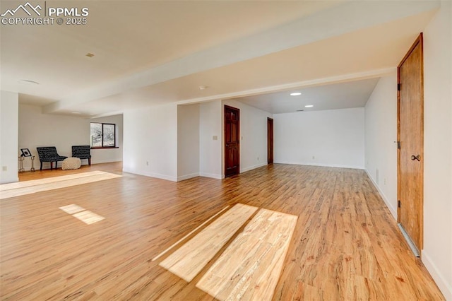 empty room with light hardwood / wood-style floors