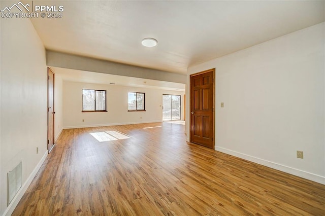 unfurnished room featuring light wood-type flooring