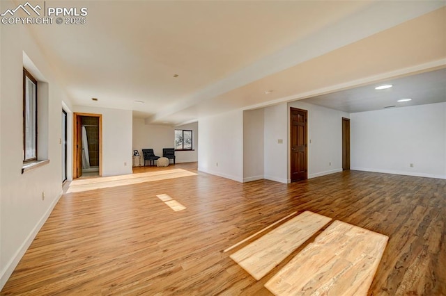 unfurnished living room with hardwood / wood-style floors