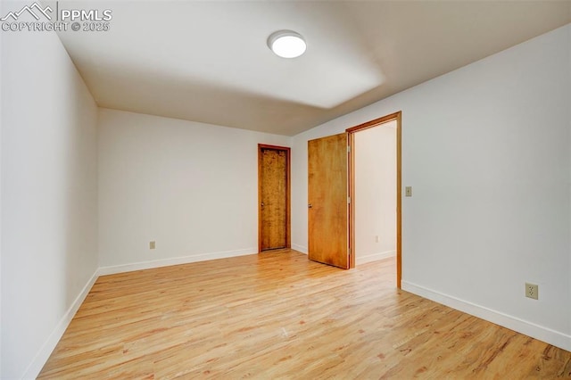 empty room with light hardwood / wood-style floors