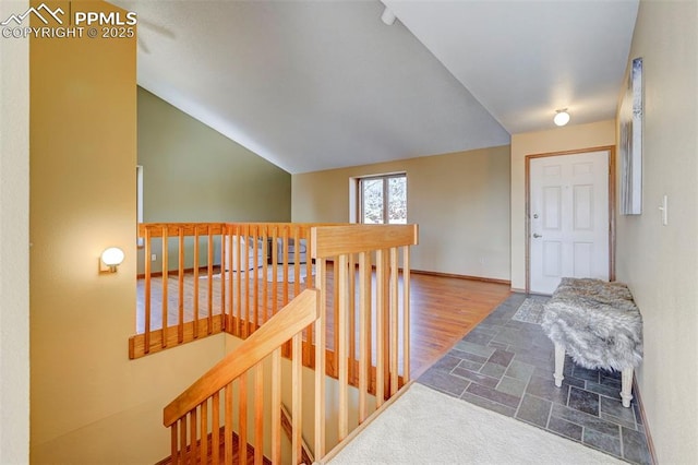 hall with lofted ceiling