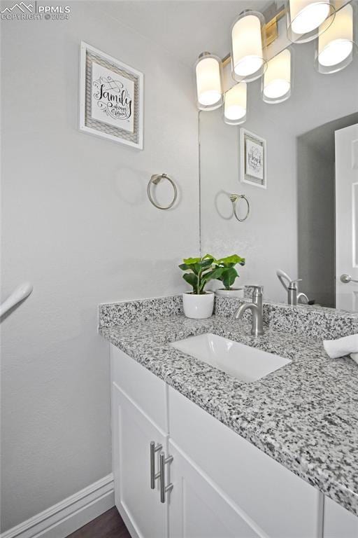 bathroom featuring vanity and wood-type flooring