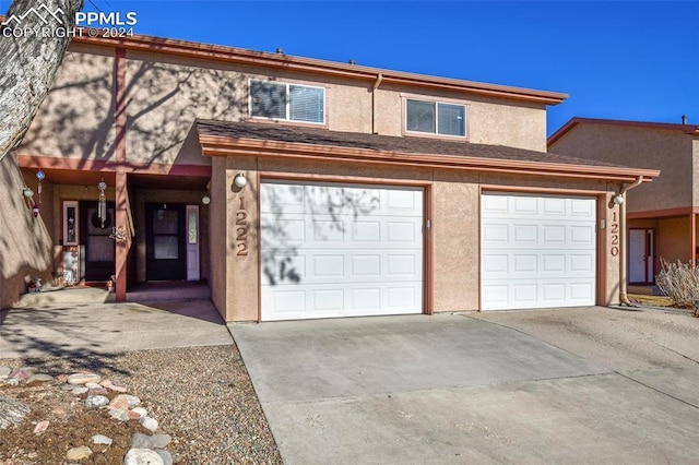 view of front of property featuring a garage