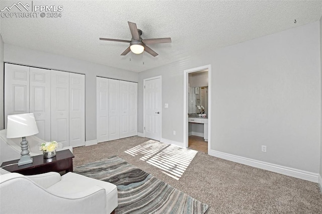 interior space featuring ceiling fan and a textured ceiling