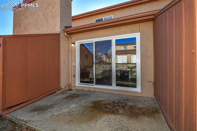 doorway to property featuring a patio area