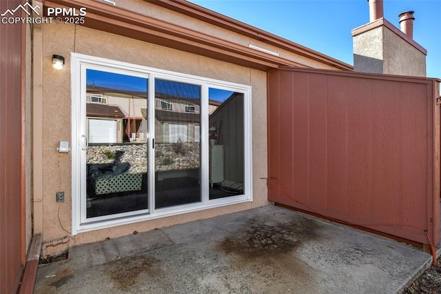 view of side of property with a patio