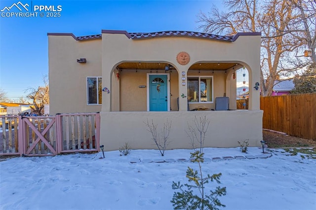 mediterranean / spanish-style house featuring covered porch