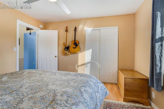 bedroom with ceiling fan, a closet, and light hardwood / wood-style floors