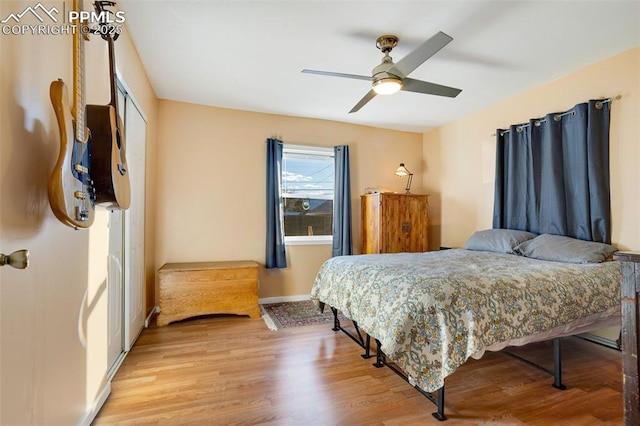 bedroom featuring ceiling fan and light hardwood / wood-style flooring