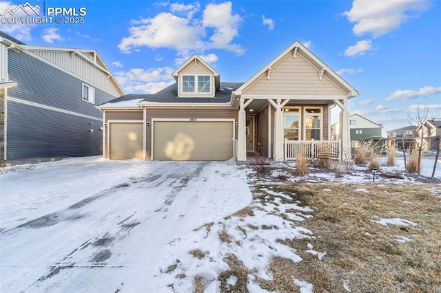 view of front of house with a porch and a garage