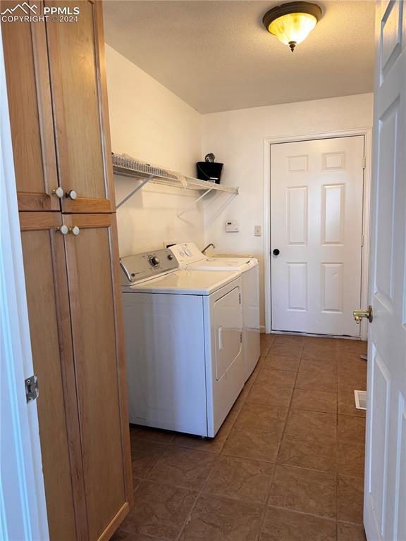 laundry area with separate washer and dryer