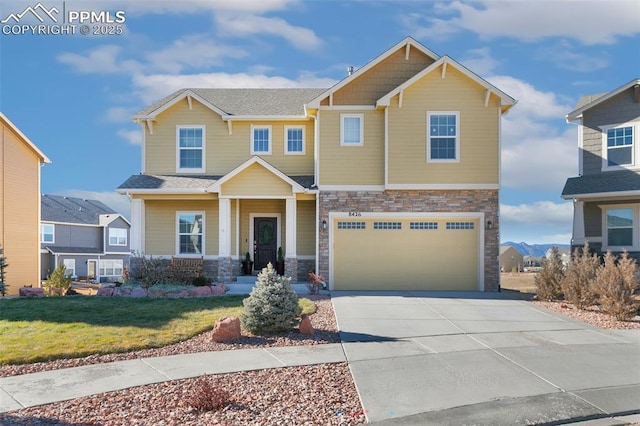 craftsman-style house with a garage and a front lawn