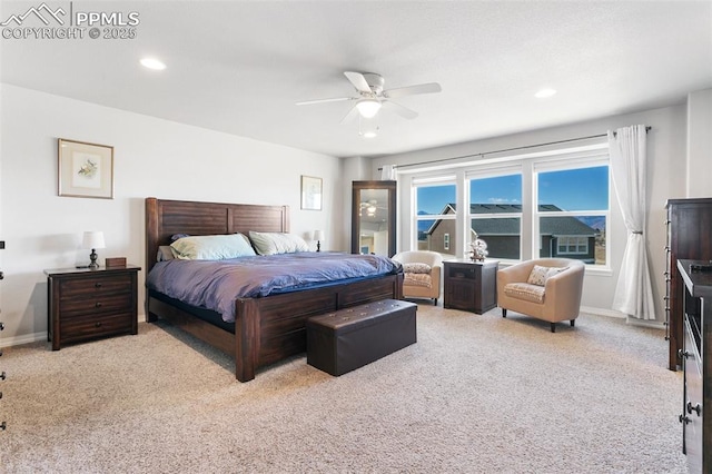 carpeted bedroom featuring ceiling fan