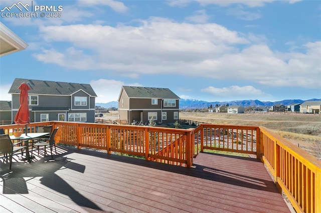 wooden terrace featuring a mountain view