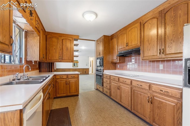 kitchen with wall oven, black microwave, sink, electric cooktop, and dishwasher