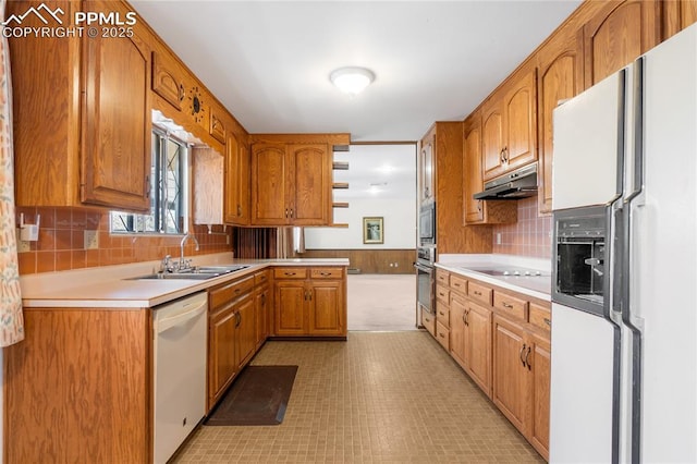 kitchen featuring decorative backsplash, appliances with stainless steel finishes, and sink