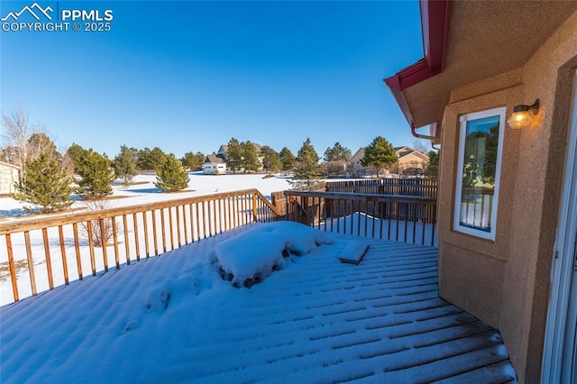 view of snow covered deck