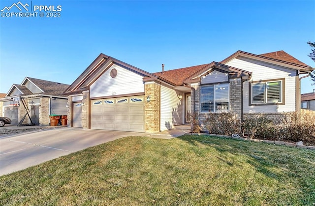 view of front of home with a front lawn and a garage