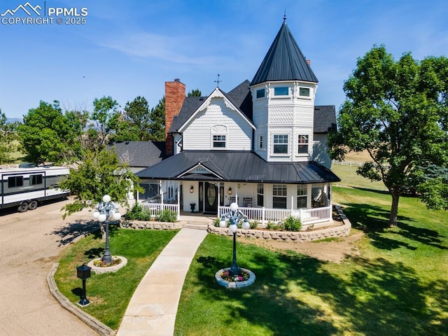 victorian home featuring a front yard and a porch