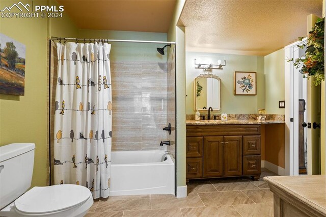 full bathroom featuring vanity, shower / bath combination with curtain, a textured ceiling, and toilet