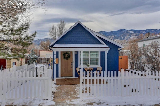 view of front of property with a mountain view