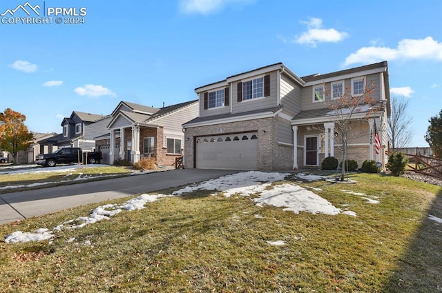 view of property with a front lawn and a garage