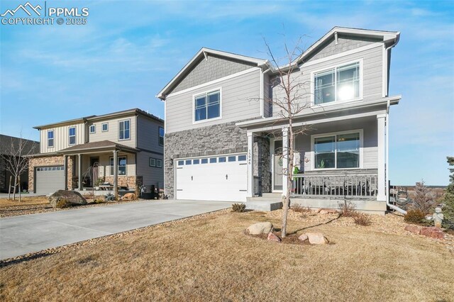 view of front of property featuring covered porch and a garage