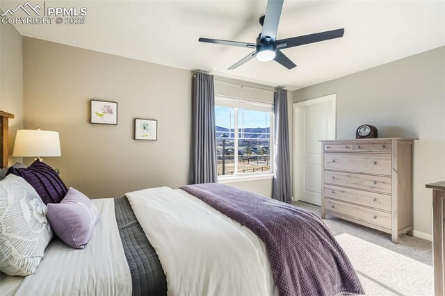 bedroom with ceiling fan and light colored carpet