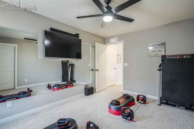 workout room featuring carpet floors and ceiling fan