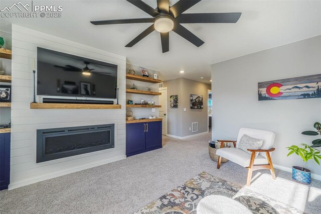 carpeted living room featuring a fireplace