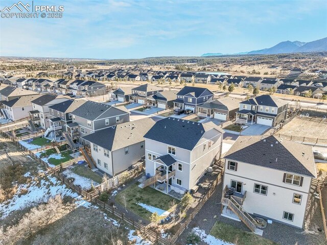 birds eye view of property with a mountain view