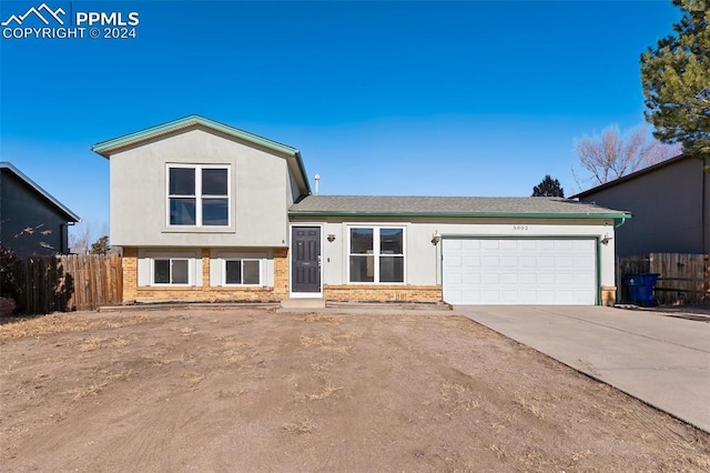 split level home featuring a garage