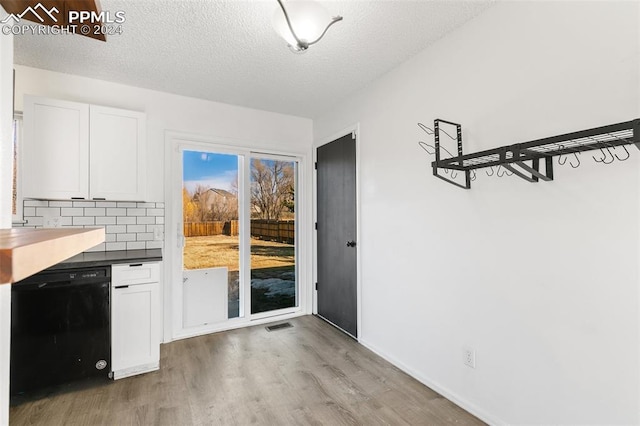 interior space with hardwood / wood-style floors and a textured ceiling