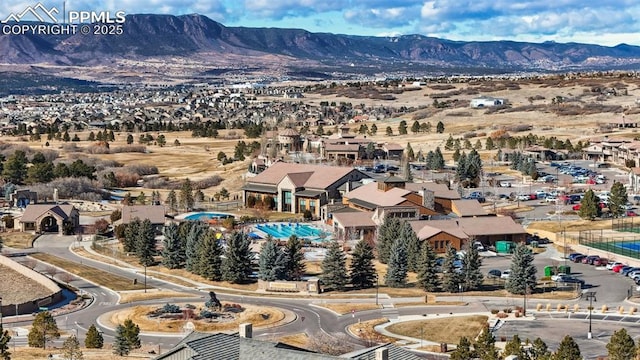 birds eye view of property with a mountain view