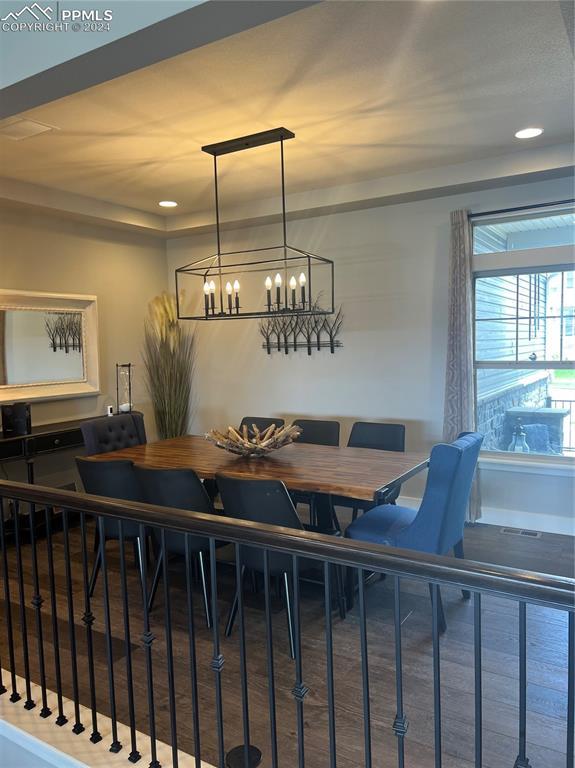 dining space featuring an inviting chandelier