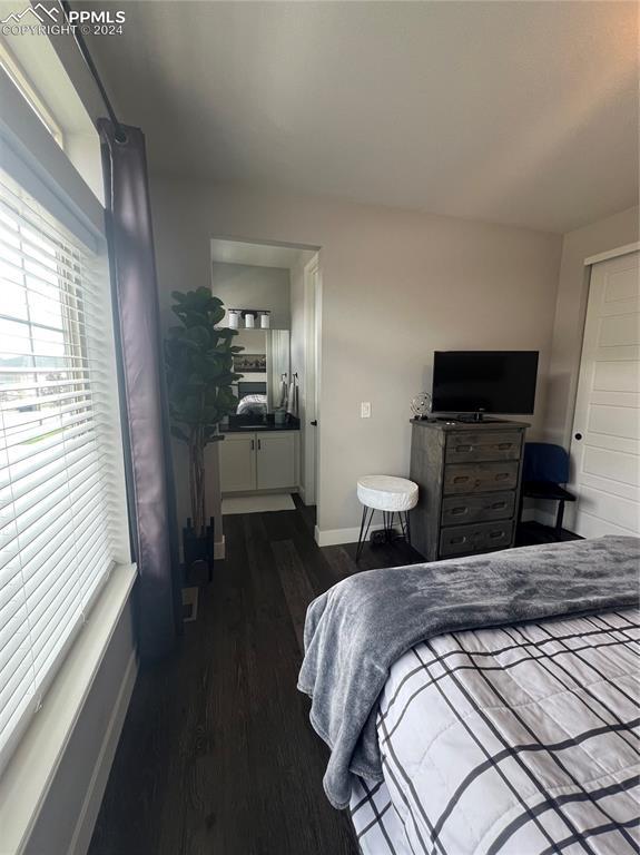 bedroom featuring dark hardwood / wood-style floors