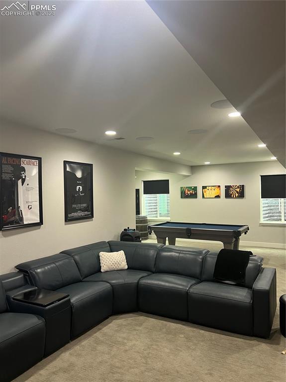 carpeted living room with billiards