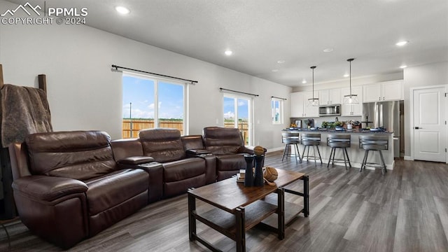 13358 Savannah Falls Ct, Peyton, CO 80831 - living area with baseboards, recessed lighting, and dark wood finished floors