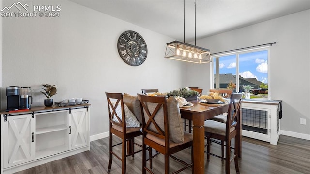 13358 Savannah Falls Ct, Peyton, CO 80831 - dining room featuring dark wood-style floors and baseboards