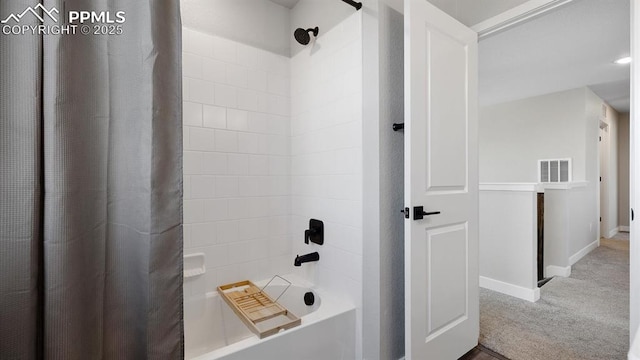 13358 Savannah Falls Ct, Peyton, CO 80831 - bathroom with shower / bath combo with shower curtain, baseboards, and visible vents