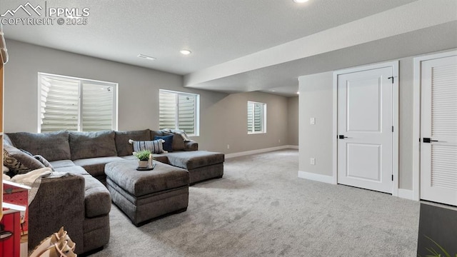 13358 Savannah Falls Ct, Peyton, CO 80831 - carpeted living room with baseboards, visible vents, and a textured ceiling