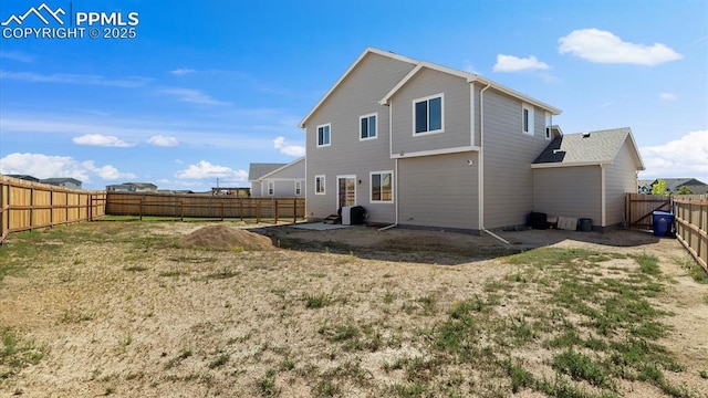 13358 Savannah Falls Ct, Peyton, CO 80831 - back of property featuring a fenced backyard and a patio