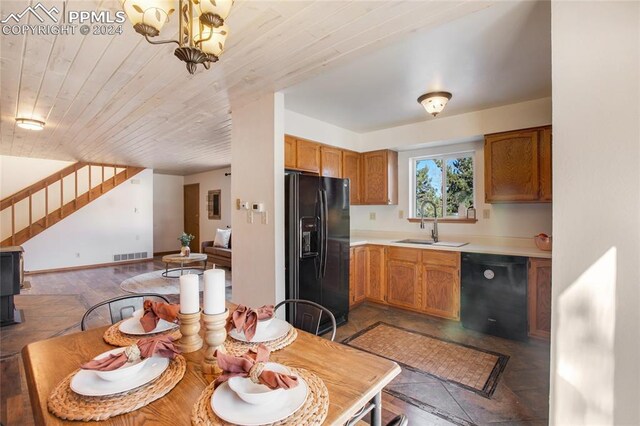 kitchen featuring sink, a notable chandelier, wooden ceiling, and black appliances