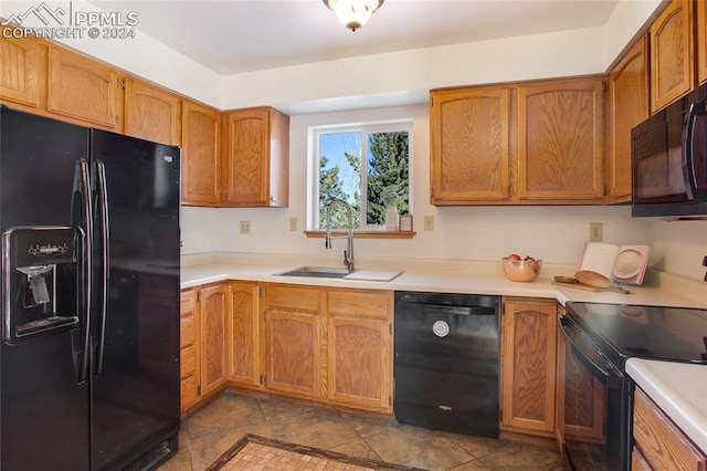 kitchen featuring sink and black appliances