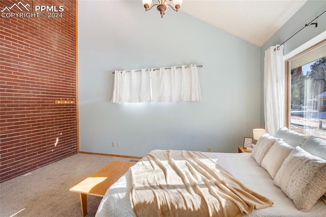 bedroom with light carpet, brick wall, a chandelier, and lofted ceiling