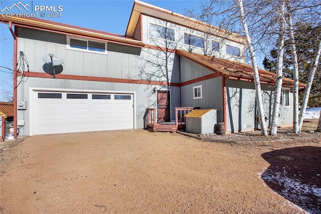 view of front of property with a garage