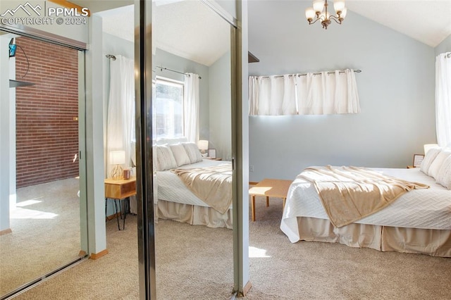 carpeted bedroom featuring a closet, vaulted ceiling, and an inviting chandelier