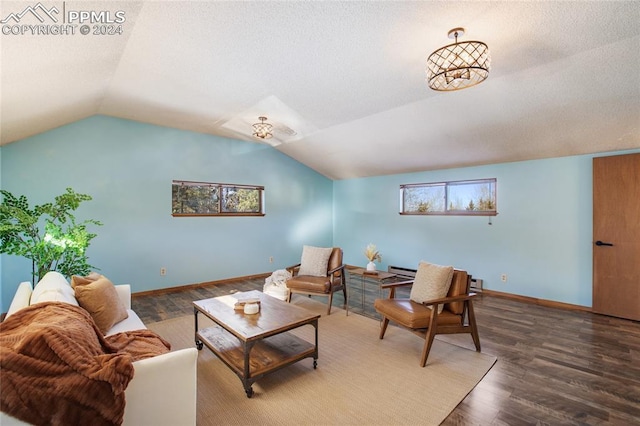 living room with dark wood-type flooring and vaulted ceiling